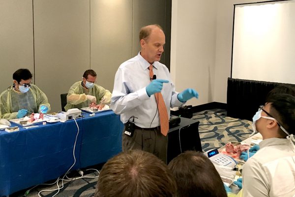 Faculty Director leading dental implant surgical course